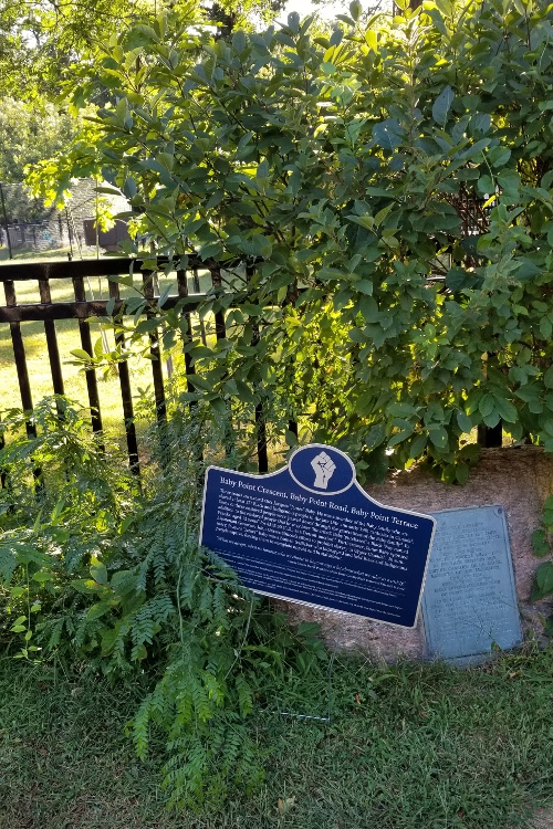 Picture of a plaque at Baby Point Road, outside the Baby Point Club Park.